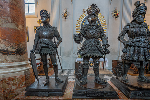 Innsbruck, Austria - Nov 15, 2019: Statues of King Arthur and King Ferdinand I of Portugal at Hofkirche (Court Church) - Innsbruck, Austria