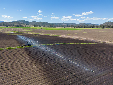 Irrigation equipment watering freshly planed farmland in rural Australia showing extent of watering