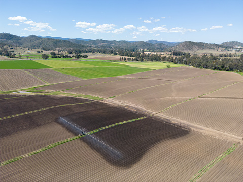 Irrigation equipment watering freshly planed farmland in rural Australia showing extent of watering