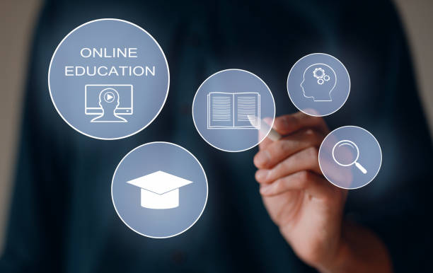 istock E-learning and Online Education concept. Male student learning internet lesson and pointing pen to device screen icon 1693029889