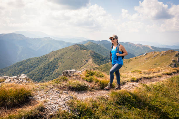Young woman hiking in the mountain alone.