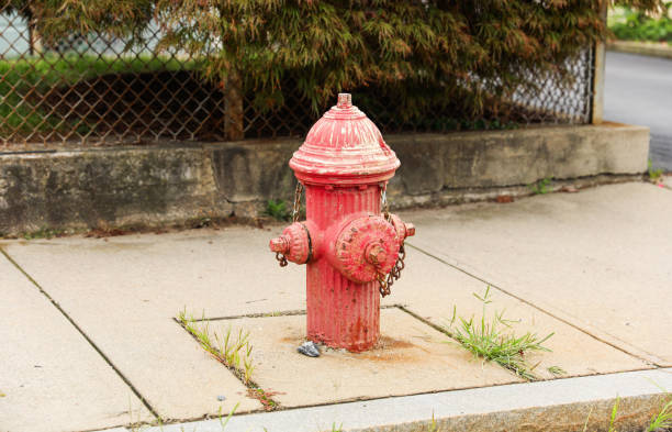 istock fire hydrant stands tall on a sunny street corner, ready to protect and symbolize safety in urban environments 1693073237