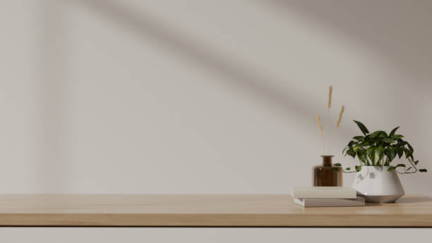 istock Empty space for your product display on a wooden tabletop against the white wall. 1693081030