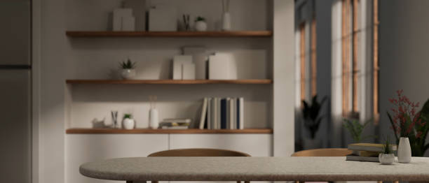 istock Empty space for displaying your product on a dining table in a modern dining room at night. 1693081144