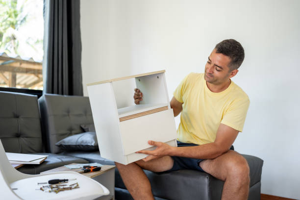 istock Man admiring the cabinet he assembled on his own. 1693104725