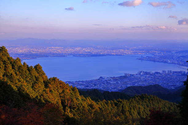 Autumn leaves and sunset view of Lake Biwa seen from Mt. Hiei Autumn leaves and sunset view of Lake Biwa seen from Mt. Hiei otsu city stock pictures, royalty-free photos & images