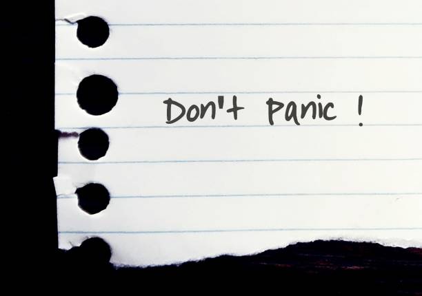 istock Torn ripped lined note paper with hand written text DONT PANIC! - concept of self motivation to stay calm in tough crisis time 1693122889