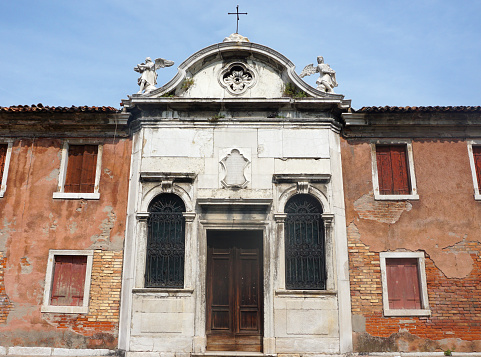 Front facade of an old church on the island of Murano, italy