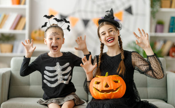 istock Happy family celebrating Halloween. 1693175027