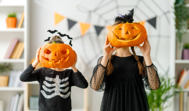 istock Happy family celebrating Halloween 1693175041