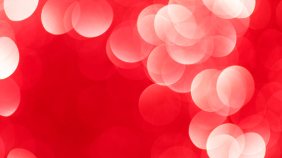 Defocused Christmas red lights background.