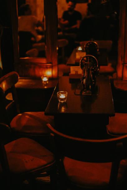 Candle in the glass on the table