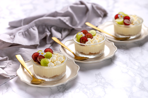 Banana mousse in a small glass. Close-up.