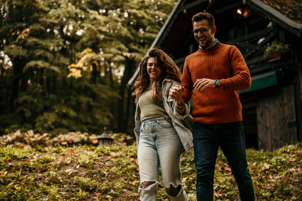 istock Joyful couple running in the nature 1693217429