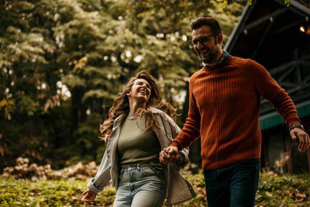 istock Joyful couple running in the nature 1693217446