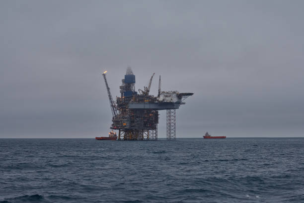 istock Offshore drilling platform in the sea, during calm weather and grey sky. 1693263298