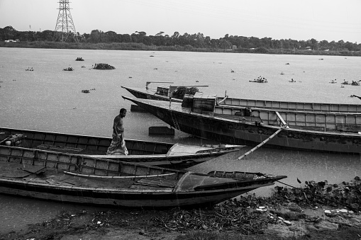 Black and white rainy day boat station photography from Ruhitpur, Bangladesh, on September 05, 2022