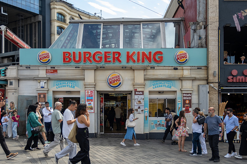 Istanbul, Turkey - September 23, 2023:Burger King branch on Istiklal Street in Istanbul and the crowd walking in front of it.