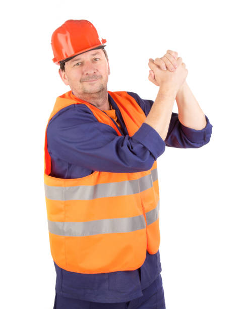 istock The worker shakes his own hands in greeting. 1693297932