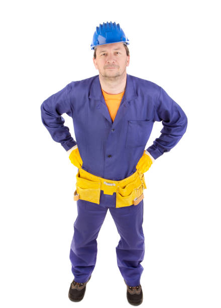 istock A worker wearing a blue protective helmet and a yellow tool belt. 1693298448
