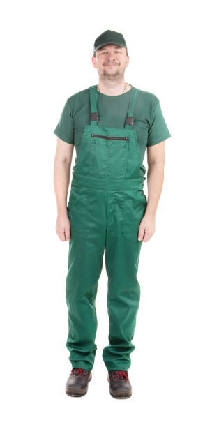 istock Worker in a green bib overalls. 1693298453