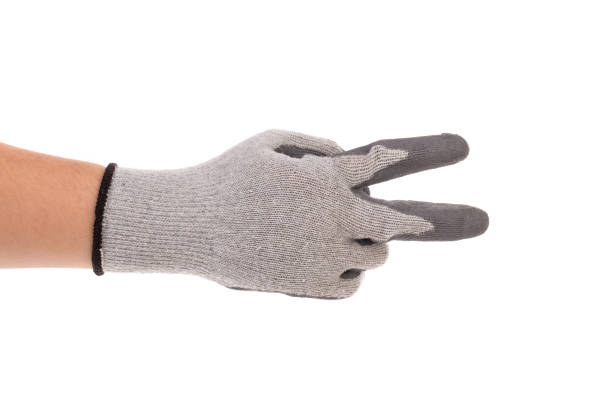 istock A gloved hand shows the number two with his hand. 1693298476