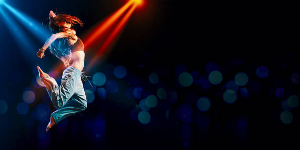 Athletic woman dancing on stage