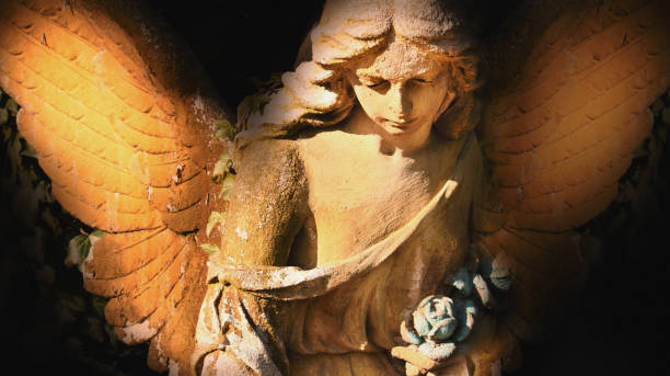 istock golden angel in the sunlight (antique statue) 1693323522