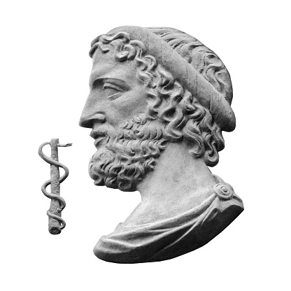 Asclepius god of treatment and medicine, he also learned to resurrect the dead. Ancient statue isolated on white background.