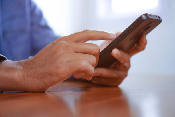istock Man Touching Smartphone Screen, Sending Messages or Online Shopping Concepts 1693341401