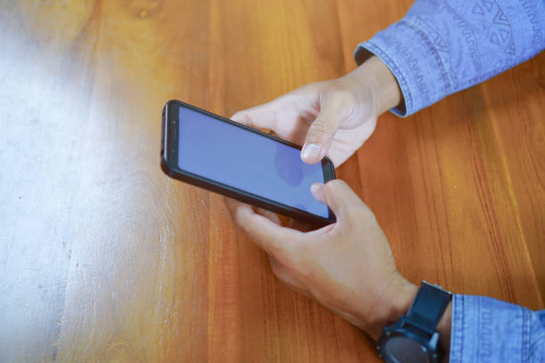 istock Man Touching Smartphone Screen, Sending Messages or Online Shopping Concepts 1693341944