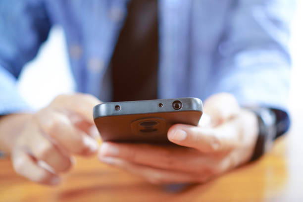 istock Man Touching Smartphone Screen, Sending Messages or Online Shopping Concepts 1693341995
