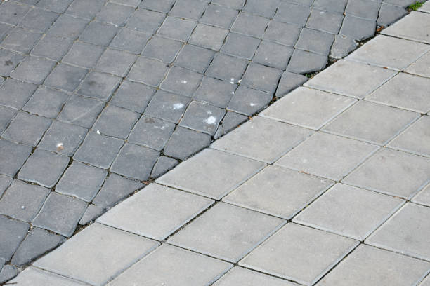 istock Pedestrian road paved with 2 types of concrete tiles, different road surfaces, patterns on the road,decorative road stones,road for walking , different but perfect patterns. 1693344182
