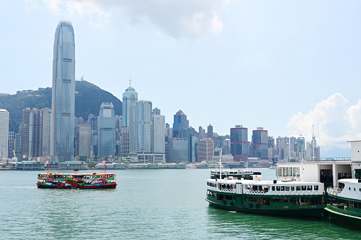 Hong Kong - May 16, 2022 : A Star Ferry at Central Ferry Pier in Hong Kong. The Star Ferry plies its way between Hong Kong Island and Kowloon.