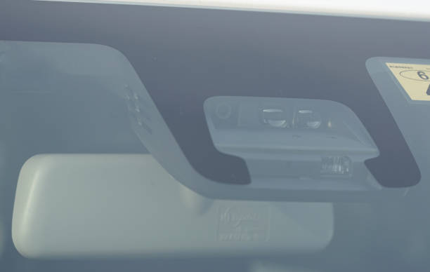istock Rearview mirror and anti-collision camera sensor seen from the windshield of the car 1693354879