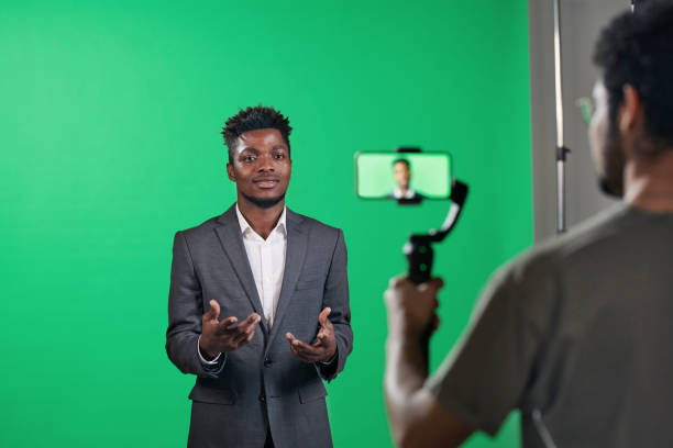 istock Man recording video content on the phone 1693357191