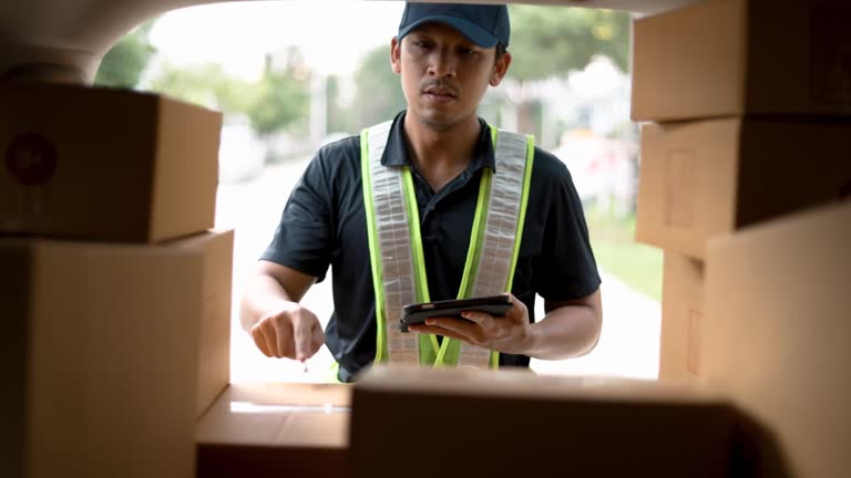 Delivery man  deliver box to a boy and mother customer with happy emotion at there home