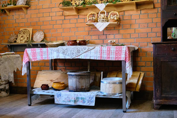 istock An old wooden table with various pots, bowls with flour, a tool for baking bread 1693376905