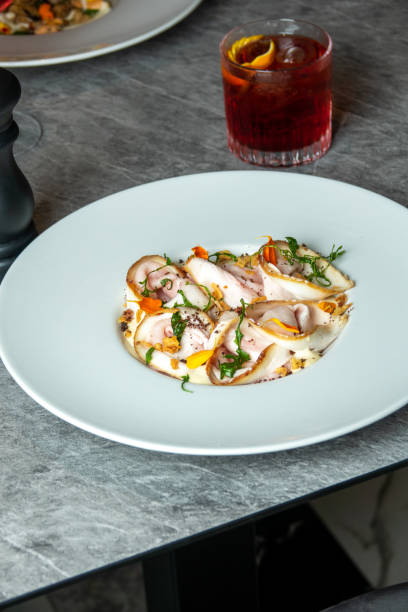 istock Pork loin dish with spices and vegetables at the restaurant table 1693377062