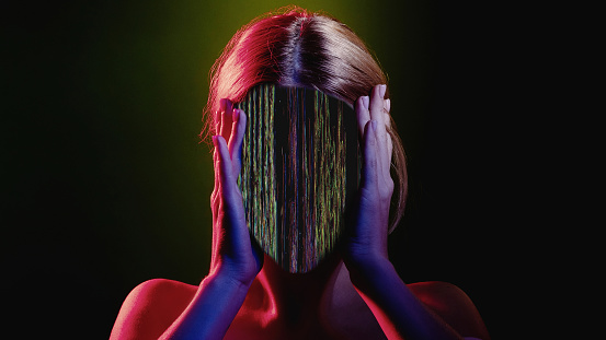 Stress anxiety. Mind control. Information overload. Red blue neon light color glitch disturbed faceless woman silhouette with static noise animation on black.