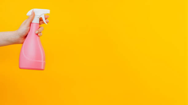 istock Cleaning equipment detergent woman hand bottle 1693388786