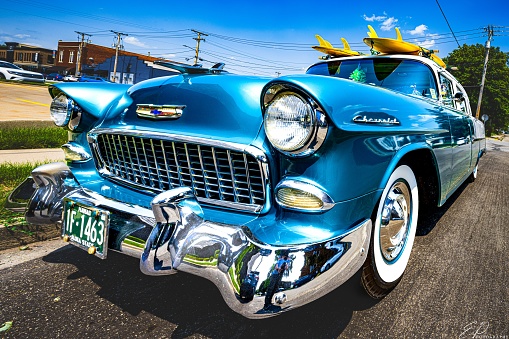 Angola, United States – March 01, 2023: A vintage blue automobile parked on a roadway