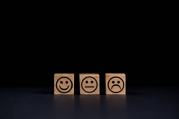 istock smiling, sad and normal face icons on black background 1693410943
