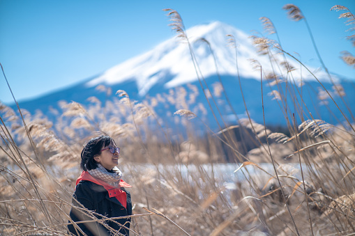 Asian woman in the field travelling Mt. Fuji, Japan