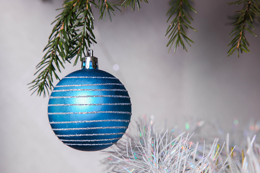 Blue ball on Christmas tree close-up.