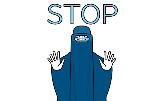 Muslim woman in burqa with her hands out in front of her body, signaling a stop.