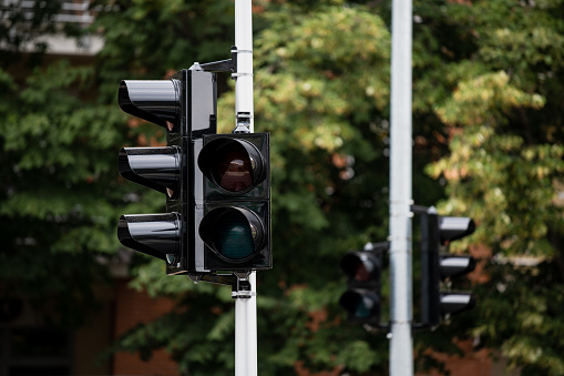 Close-up of green traffic light. Macro photo. Go forward.