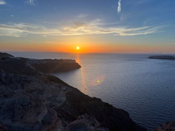 istock Santorini coastline at sunset, Greece 1693430102