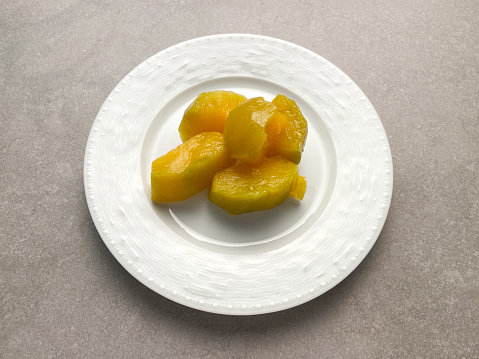 Traditional Turkish pumpkin dessert in a plate (kabak tatlisi)