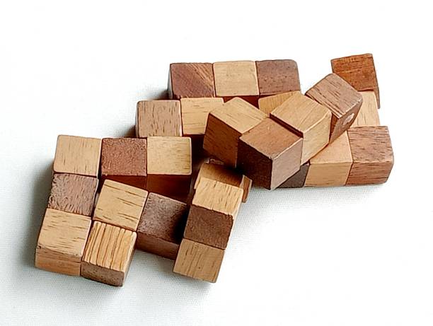 istock Wooden Rubik's cube snake an imeginetive game. 1693459376